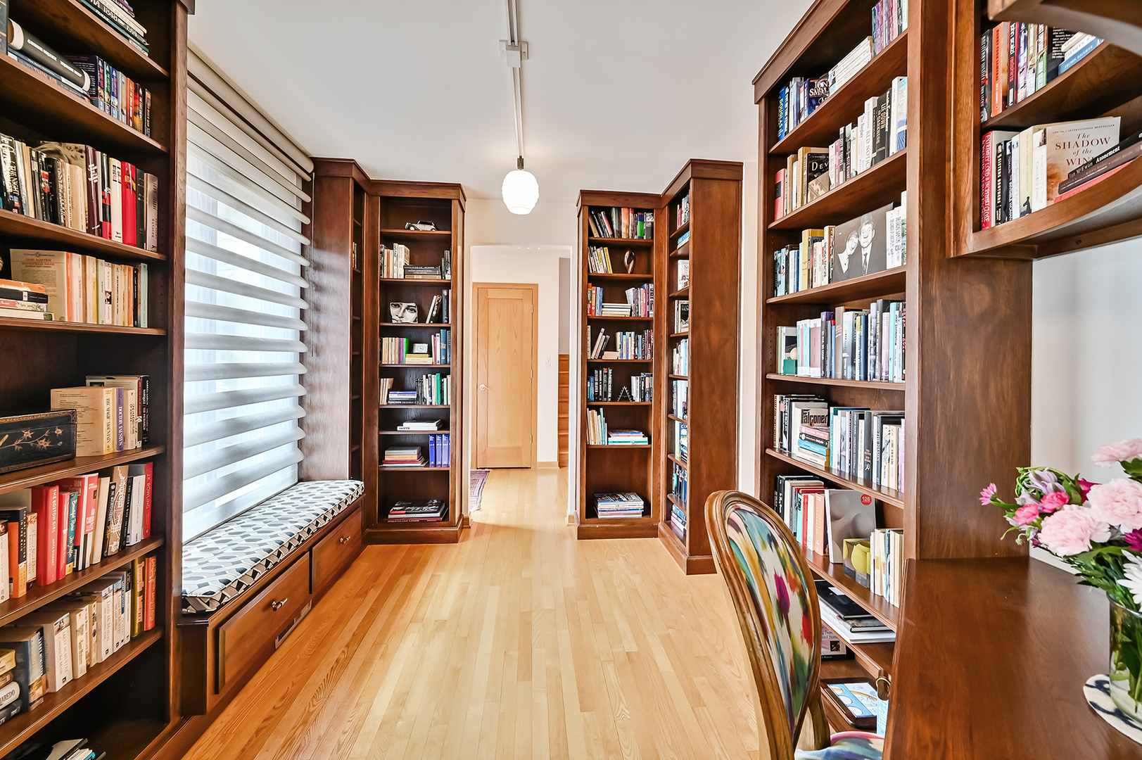 401 8th Place Hinsdale, IL 60521 - Photo 10 of 46 a hallway with a book shelf and a book shelf
