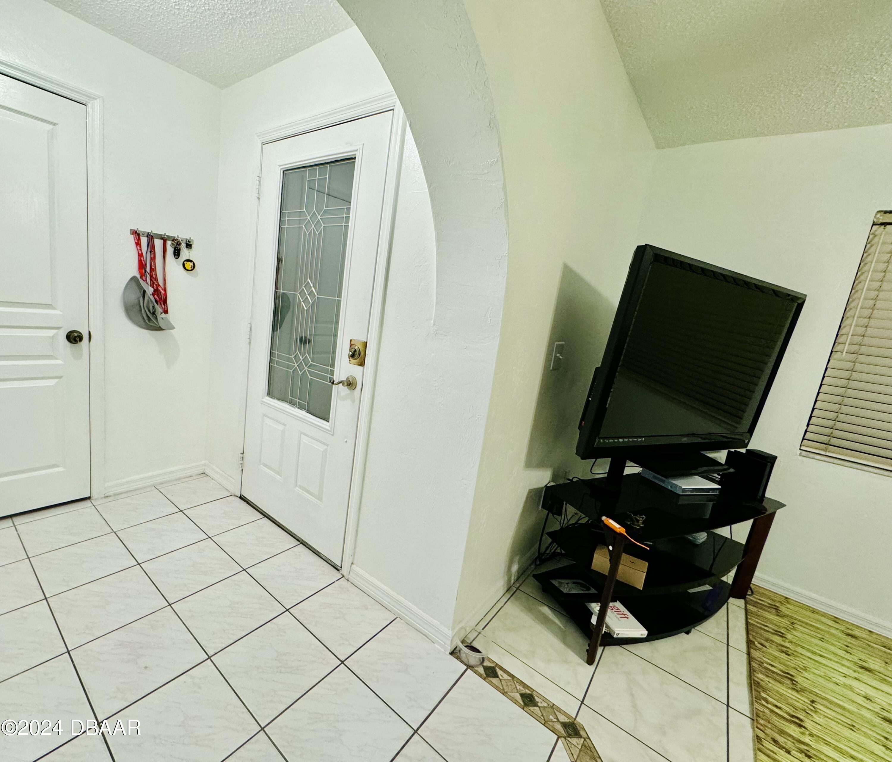 910 Big Tree Road, Unit 304 South Daytona, FL 32119 - Photo 3 of 31 Foyer entrance
