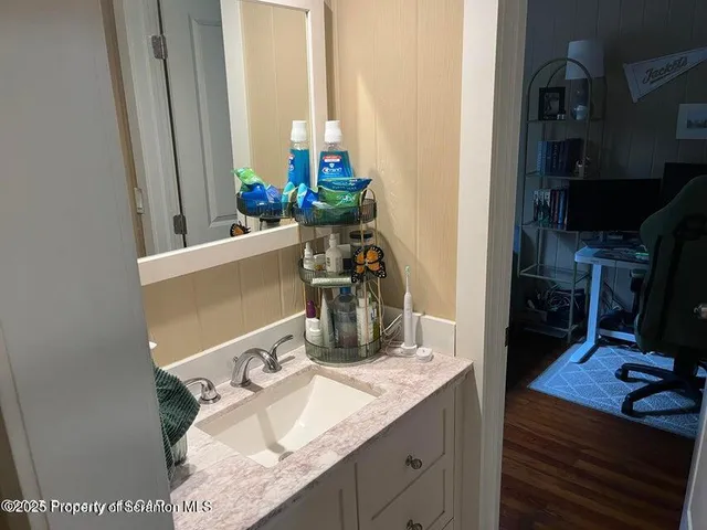 a kitchen with a sink and a stove top oven