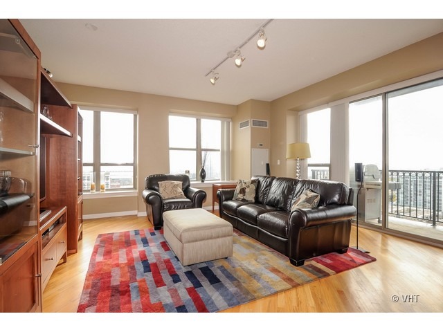 1717 South Prairie Avenue, Unit 1806 Chicago, IL 60616 - Photo 2 of 13 a living room with furniture and a flat screen tv