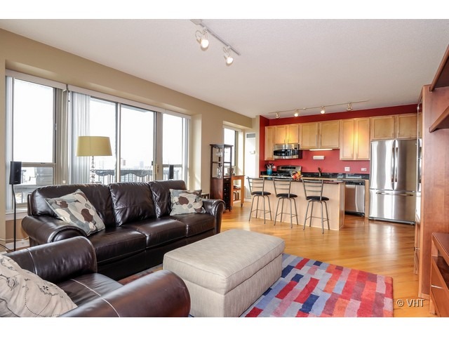 1717 South Prairie Avenue, Unit 1806 Chicago, IL 60616 - Photo 5 of 13 a living room with furniture and a large window