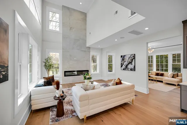 a large kitchen with a large counter top appliances and cabinets