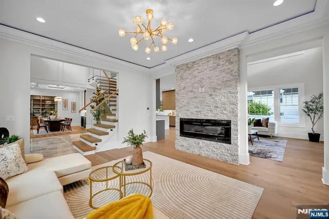 a living room with furniture and kitchen view