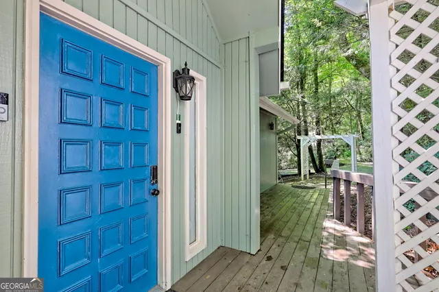 a living room with fireplace furniture and a wooden floor