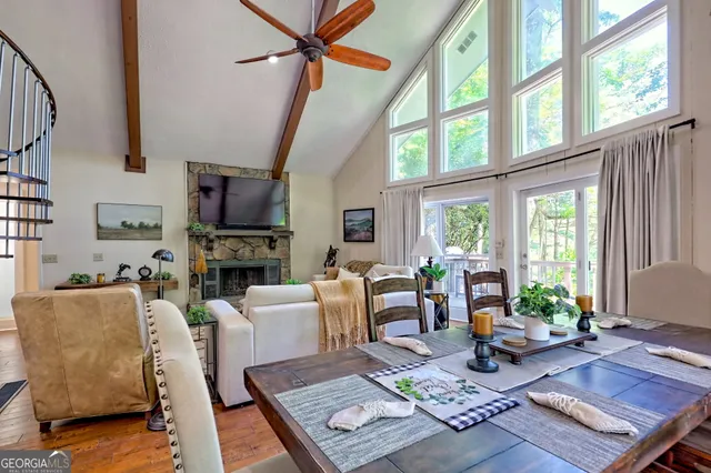 a view of balcony with wooden floor and seating