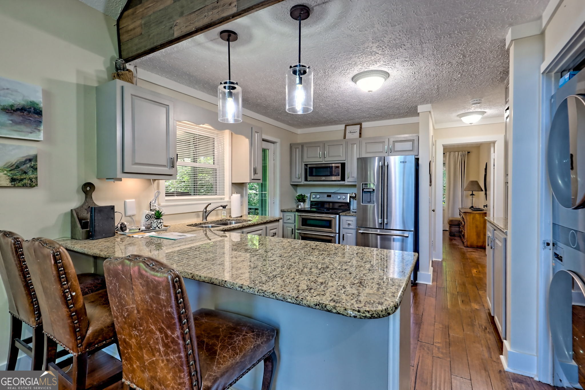 850 Ridgepole Drive Sky Valley, GA 30537 - Photo 19 of 73 a kitchen with stainless steel appliances granite countertop a sink a stove and a refrigerator