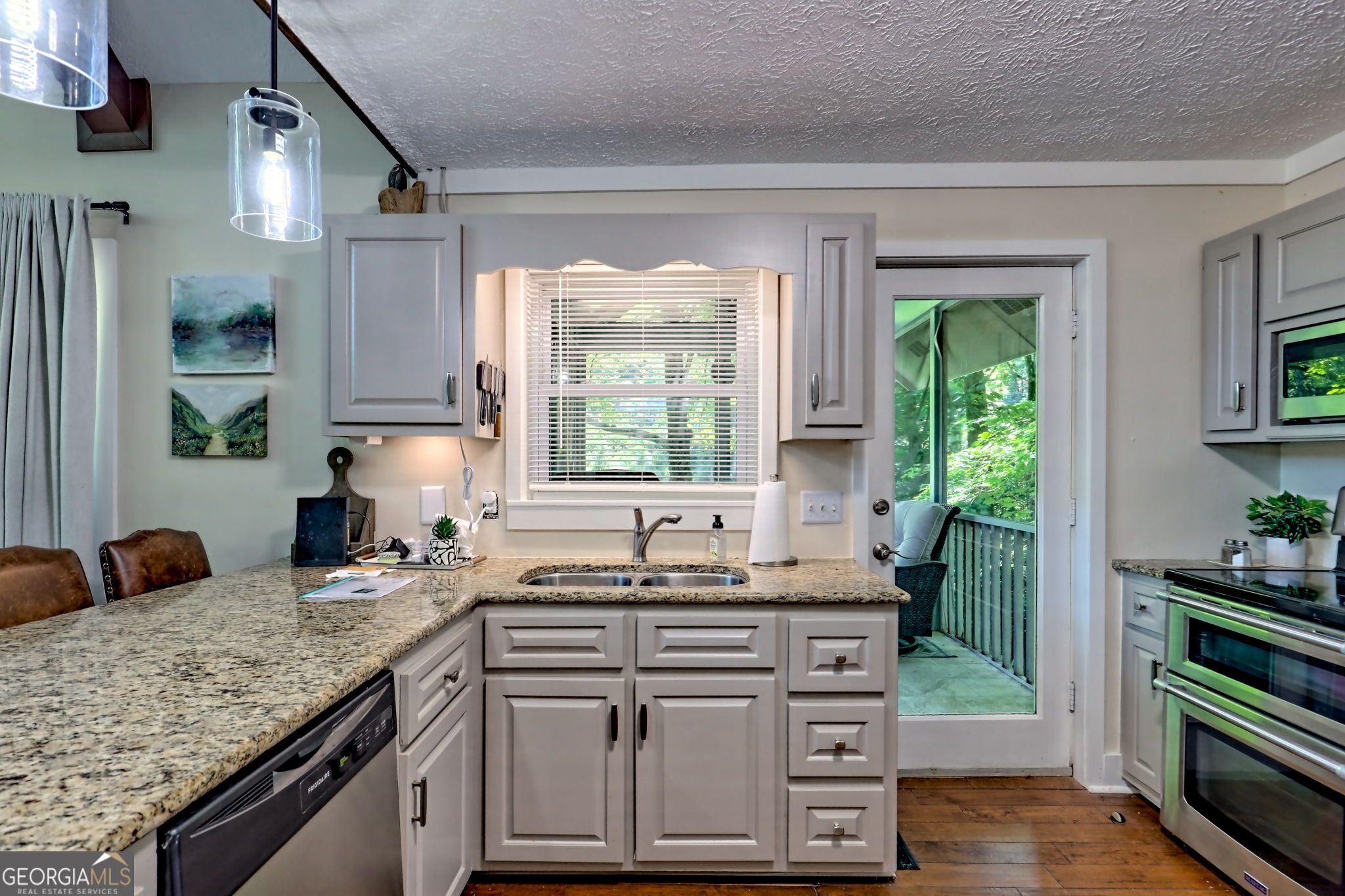 850 Ridgepole Drive Sky Valley, GA 30537 - Photo 20 of 73 a kitchen with sink stove and cabinets