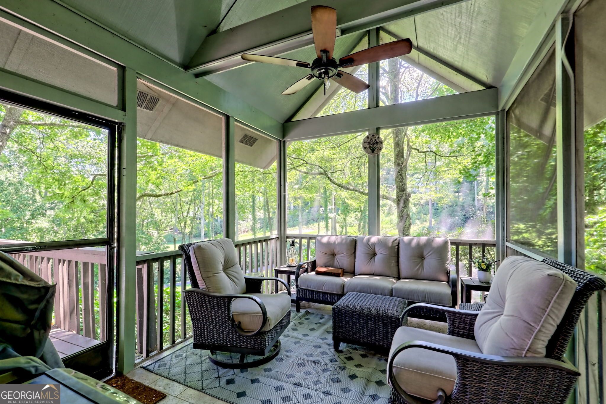 850 Ridgepole Drive Sky Valley, GA 30537 - Photo 22 of 73 a living room with furniture and a large window