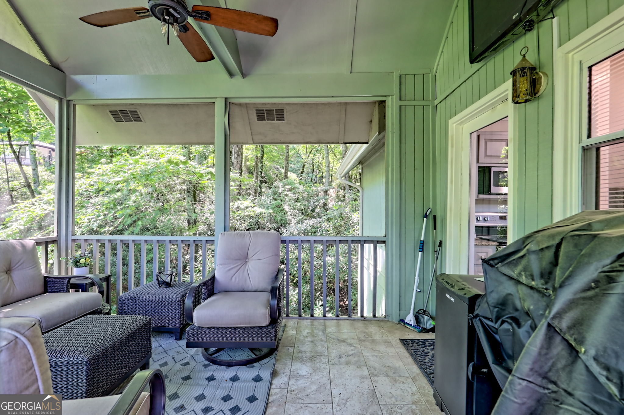 850 Ridgepole Drive Sky Valley, GA 30537 - Photo 31 of 73 a living room with furniture and a large window