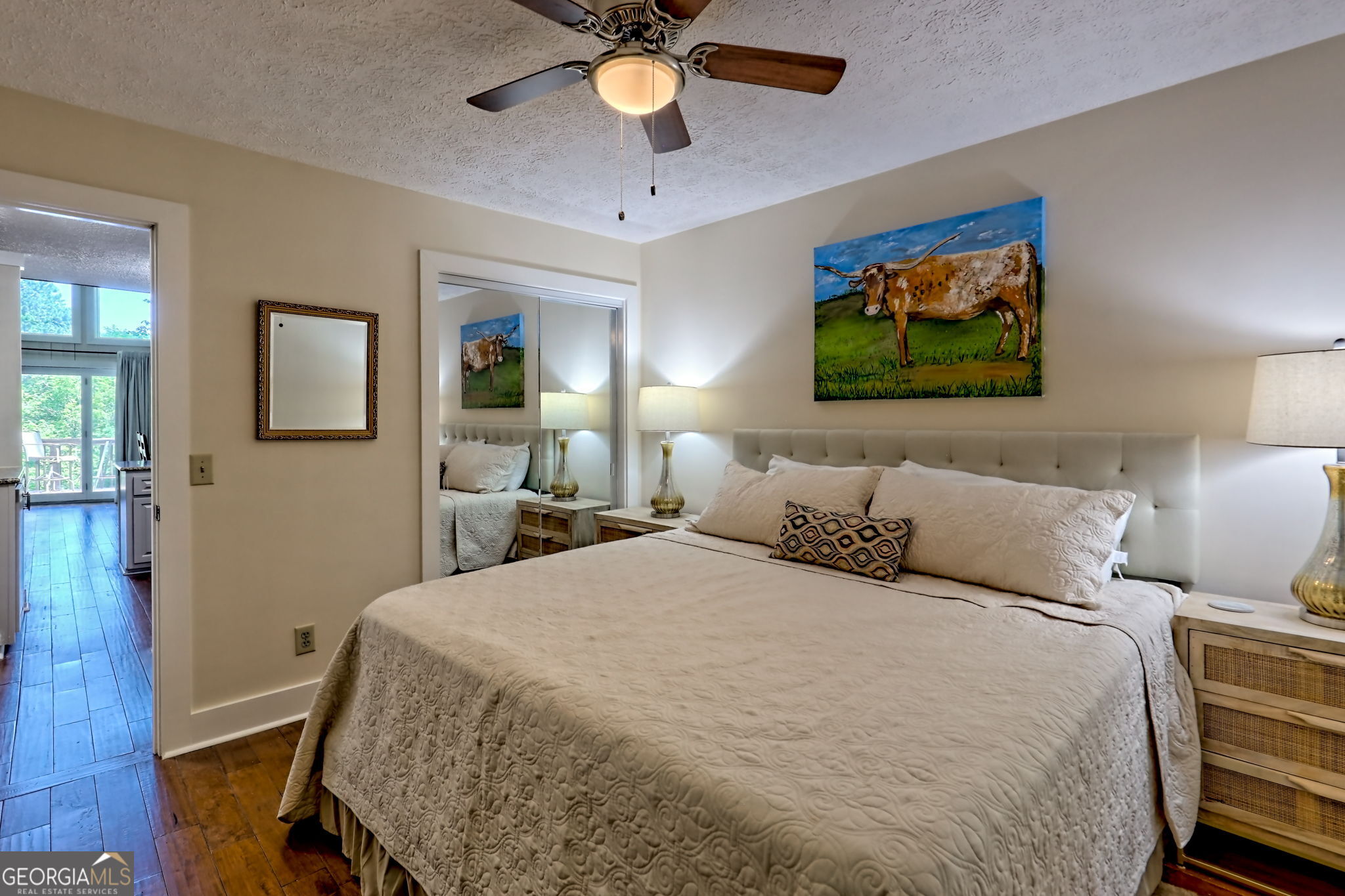 850 Ridgepole Drive Sky Valley, GA 30537 - Photo 34 of 73 a bedroom with a bed and a chandelier