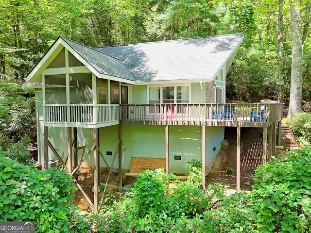 a view of a house with a tree