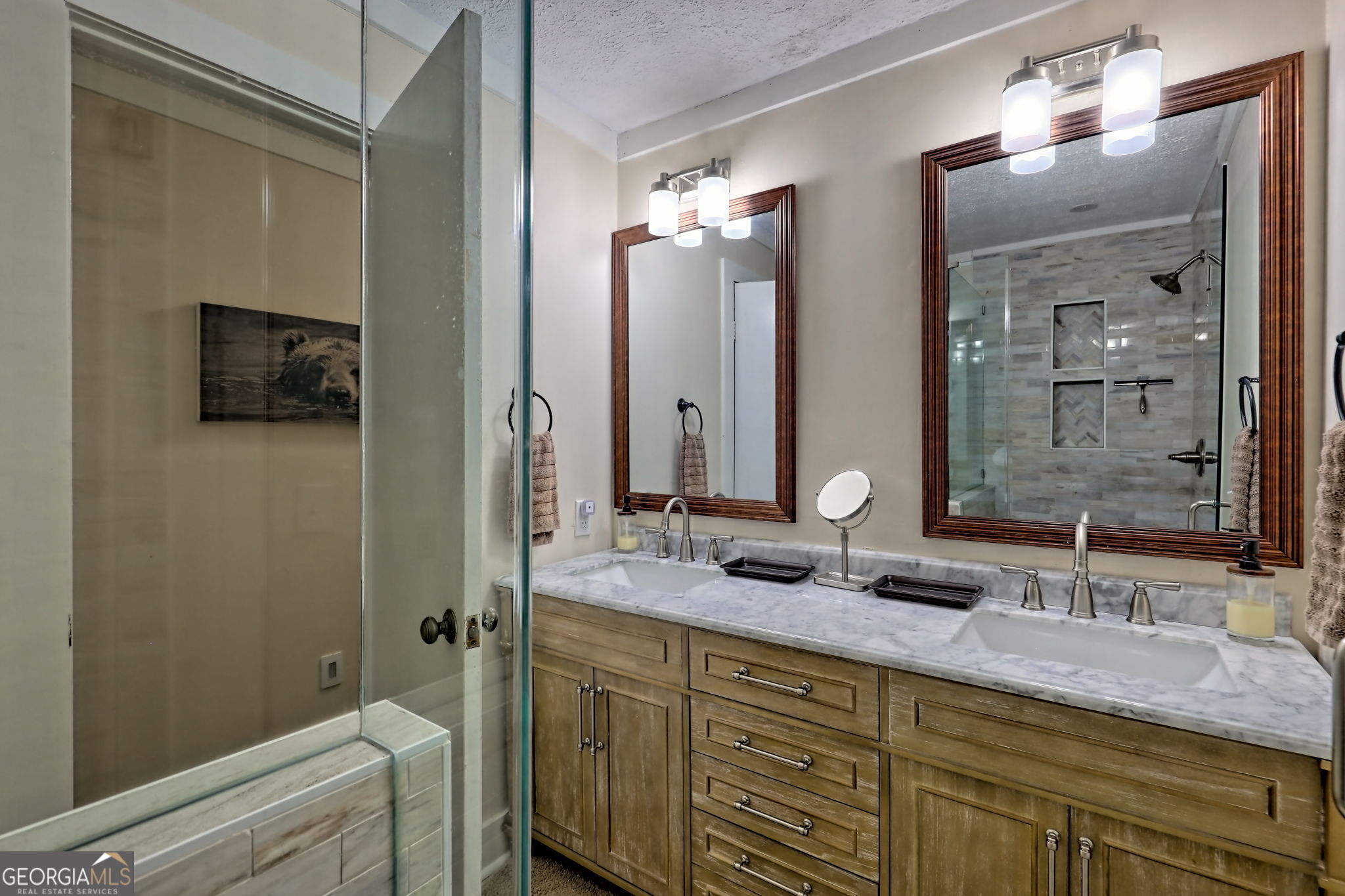 850 Ridgepole Drive Sky Valley, GA 30537 - Photo 41 of 73 a bathroom with a double vanity sink and a mirror