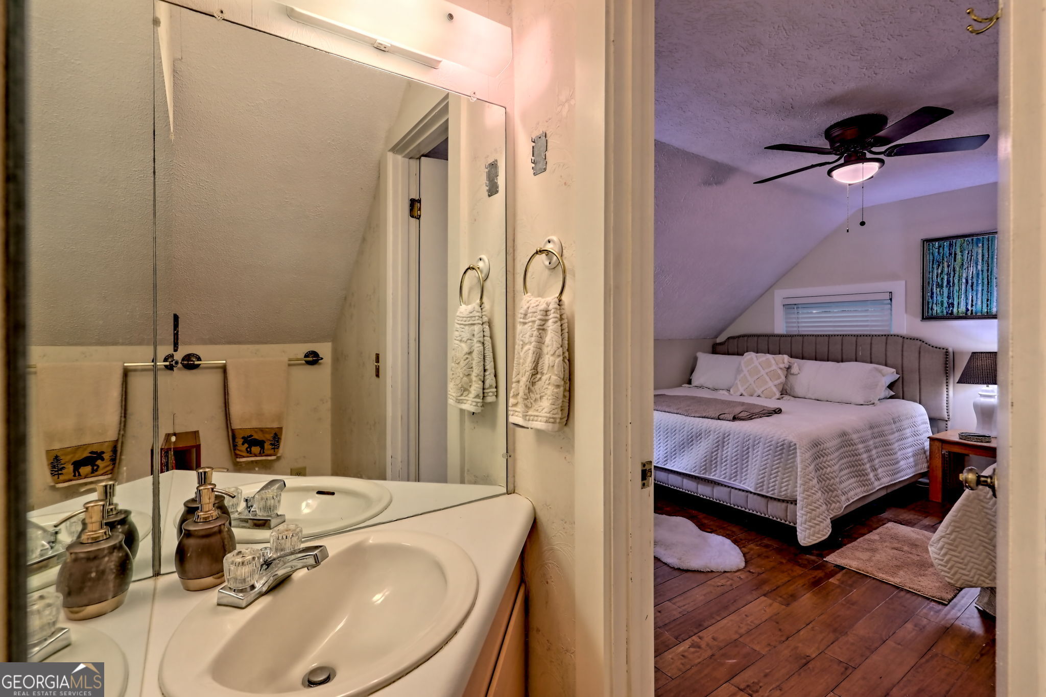 850 Ridgepole Drive Sky Valley, GA 30537 - Photo 48 of 73 a en suite bathroom with a sink and a mirror