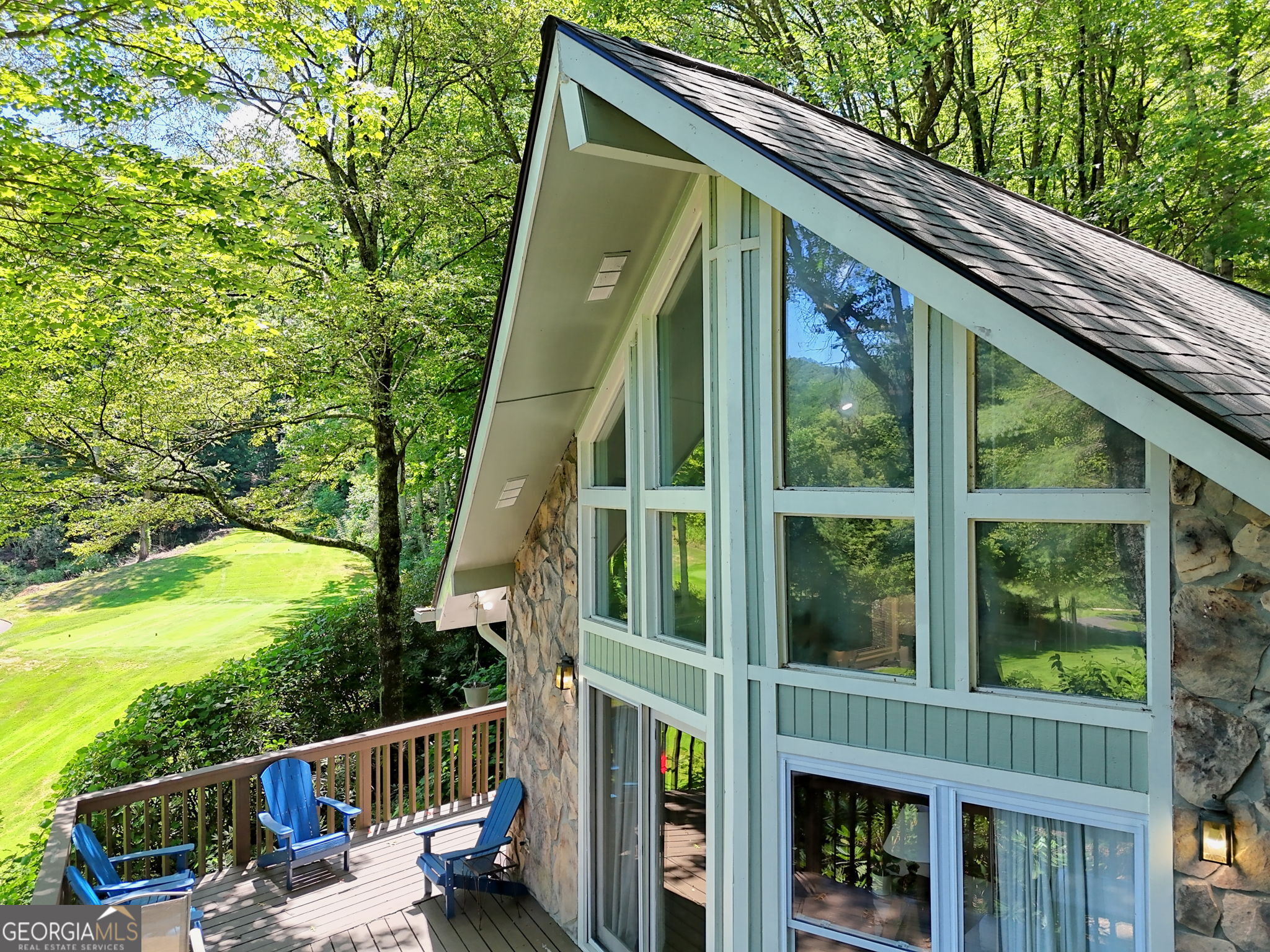 850 Ridgepole Drive Sky Valley, GA 30537 - Photo 61 of 73 a balcony of a house with wooden floor and outdoor seating
