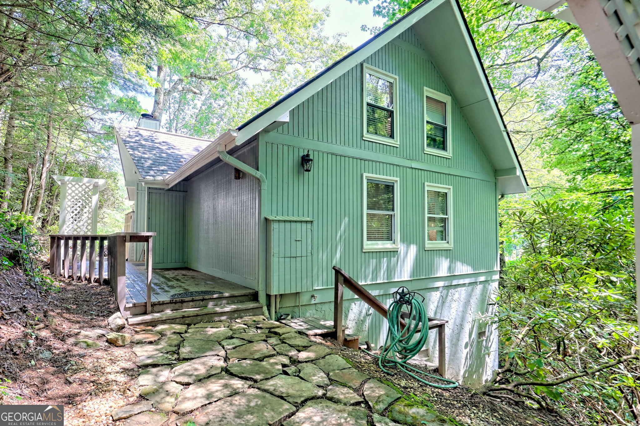 850 Ridgepole Drive Sky Valley, GA 30537 - Photo 9 of 73 a front view of a house with garden
