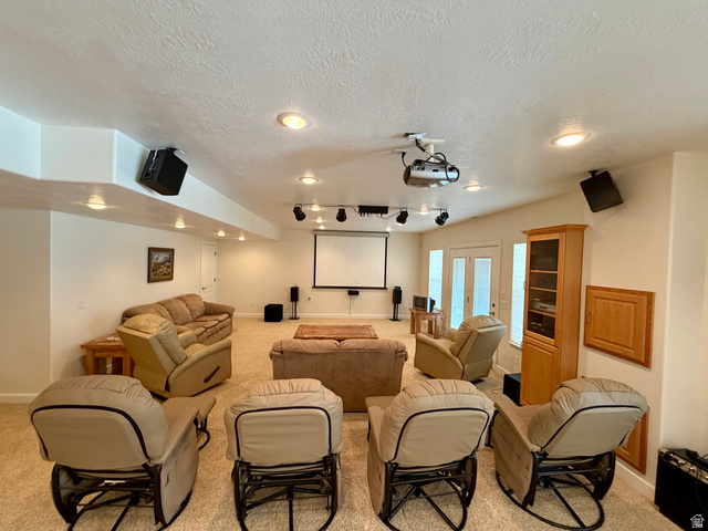 1133 Paris Canyon Road Paris, ID 83261 - Photo 23 of 75 Dedicated entertainment room featuring recessed ceiling lights, ceiling-mounted projector, and a large projection screen