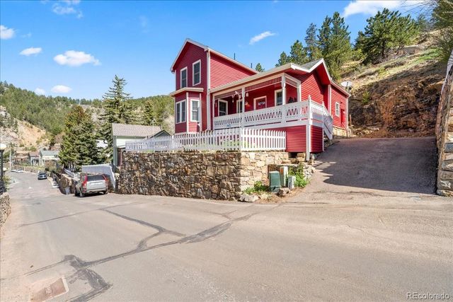 a view of a house with a street