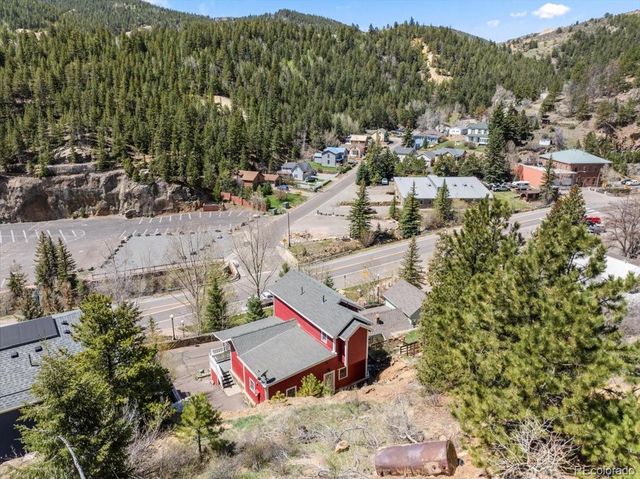 an aerial view of residential houses with outdoor space
