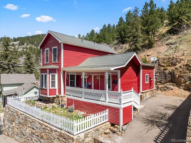a front view of a house with a porch