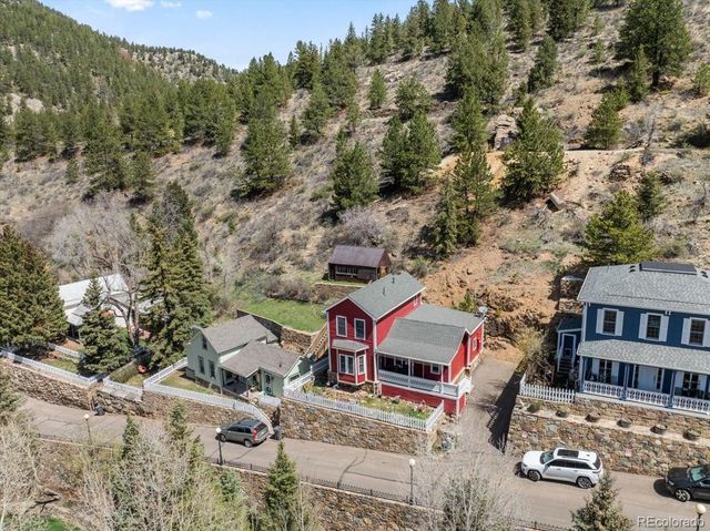 an aerial view of multiple houses with yard