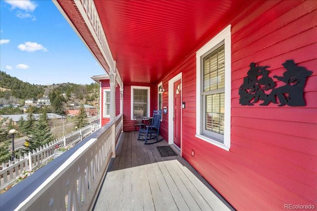 a view of a balcony with chairs