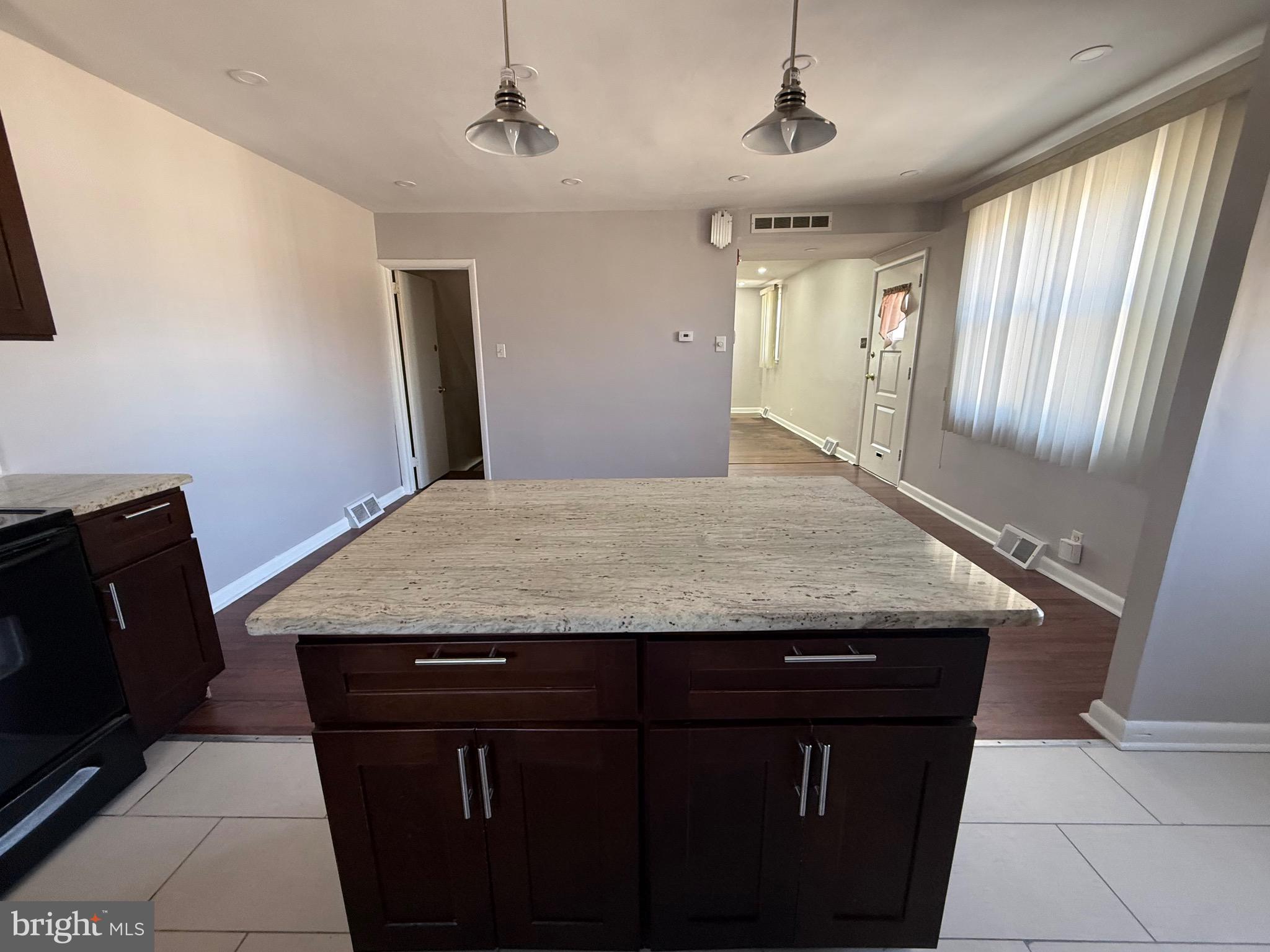 9083 Convent Avenue Philadelphia, PA 19136 - Photo 7 of 22 a view of a kitchen with granite countertop stainless steel appliances