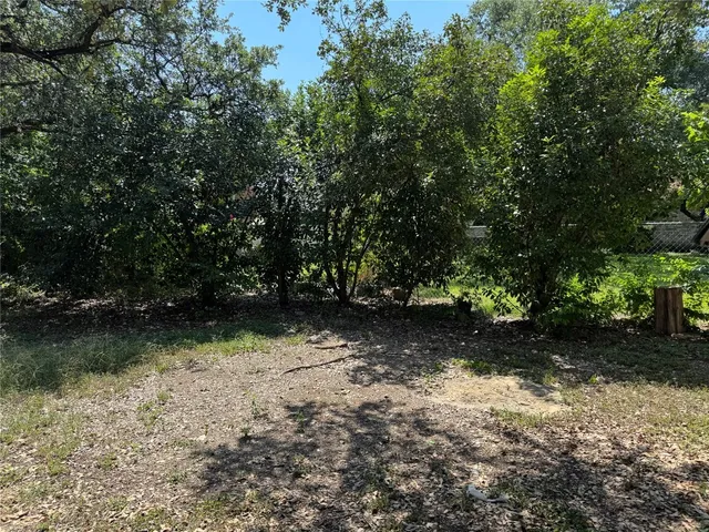 a front view of a house with a yard garage and outdoor seating