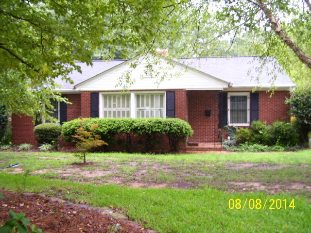 491 Pinecrest Road Macon, GA 31204 - Photo 1 of 12 a front view of a house with a yard and potted plants