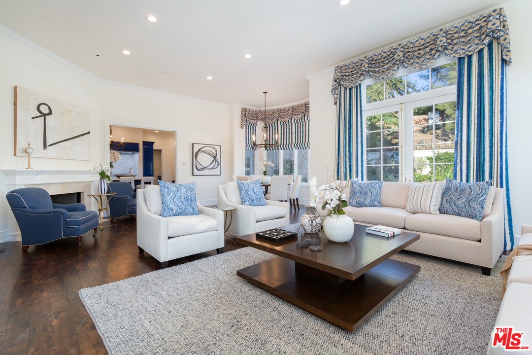 65 Beverly Park Beverly Hills, CA 90210 - Photo 12 of 51 a living room with fireplace furniture and a large window