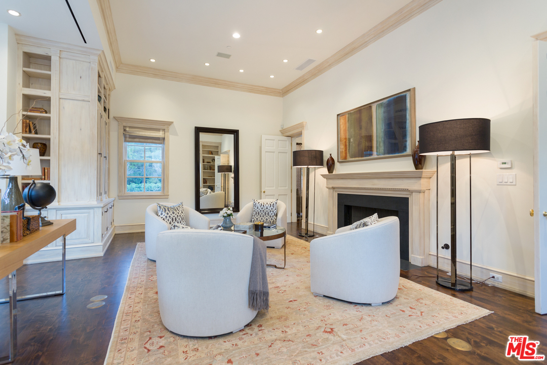 65 Beverly Park Beverly Hills, CA 90210 - Photo 13 of 51 a living room with furniture and a fireplace