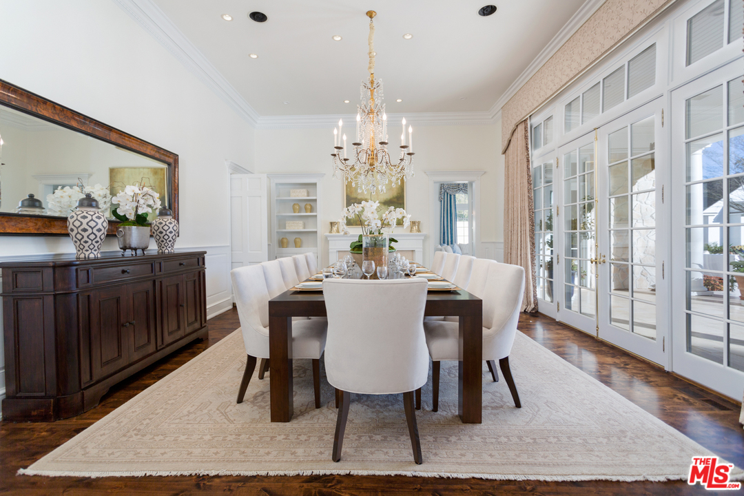 65 Beverly Park Beverly Hills, CA 90210 - Photo 14 of 51 a view of a dining room with furniture wooden floor and chandelier