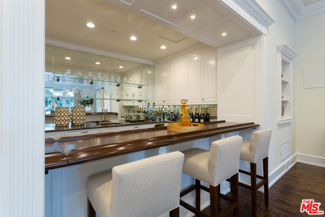 65 Beverly Park Beverly Hills, CA 90210 - Photo 16 of 51 a kitchen with kitchen island stainless steel appliances a sink and cabinets