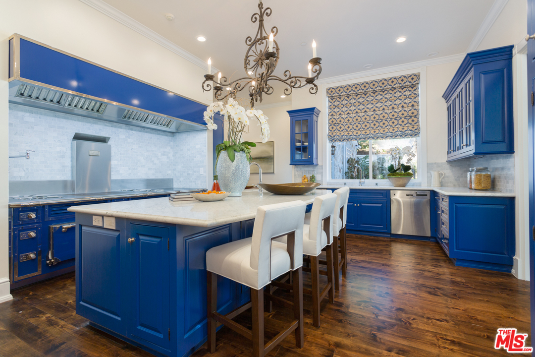 65 Beverly Park Beverly Hills, CA 90210 - Photo 20 of 51 a large kitchen with a table and chairs