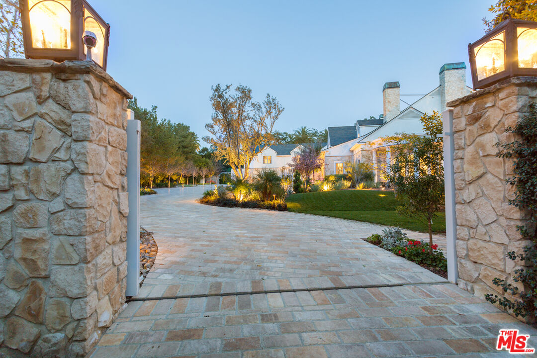 65 Beverly Park Beverly Hills, CA 90210 - Photo 3 of 51 a view of a pathway both side of building