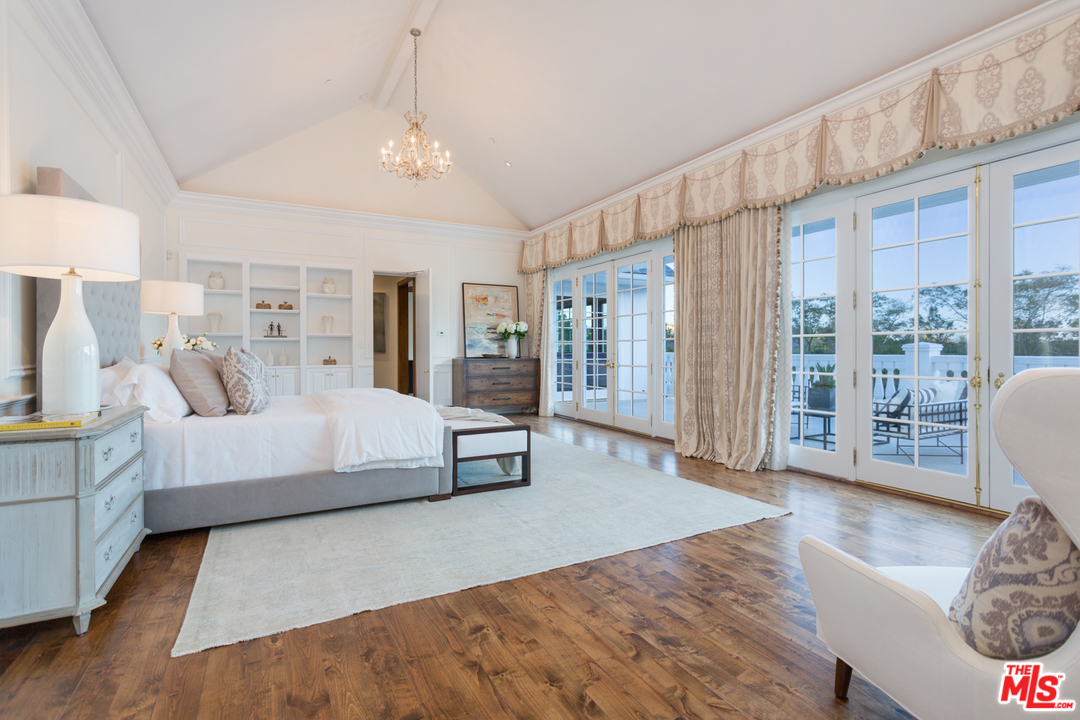 65 Beverly Park Beverly Hills, CA 90210 - Photo 23 of 51 a bedroom with a large bed and a couch