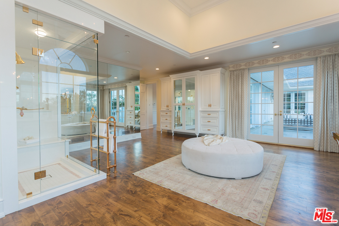 65 Beverly Park Beverly Hills, CA 90210 - Photo 28 of 51 a spacious bathroom with a tub shower and mirror