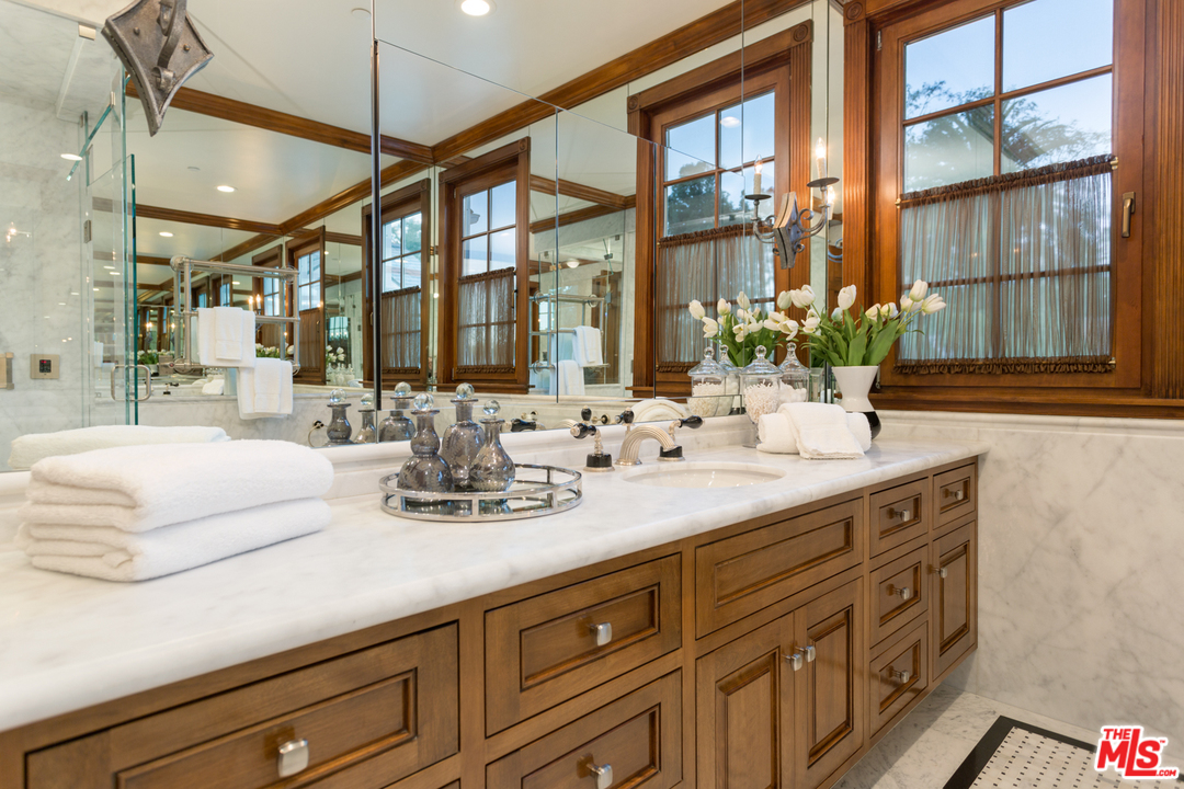 65 Beverly Park Beverly Hills, CA 90210 - Photo 31 of 51 a bathroom with double vanity and a mirror