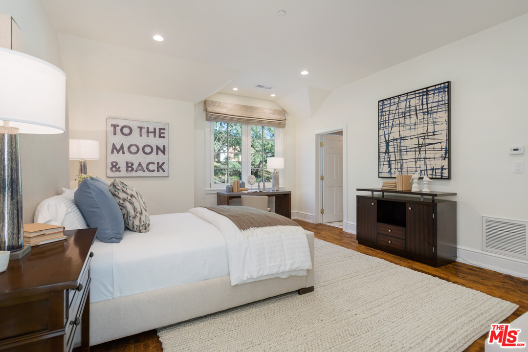 65 Beverly Park Beverly Hills, CA 90210 - Photo 34 of 51 a bedroom with a bed and a view of kitchen