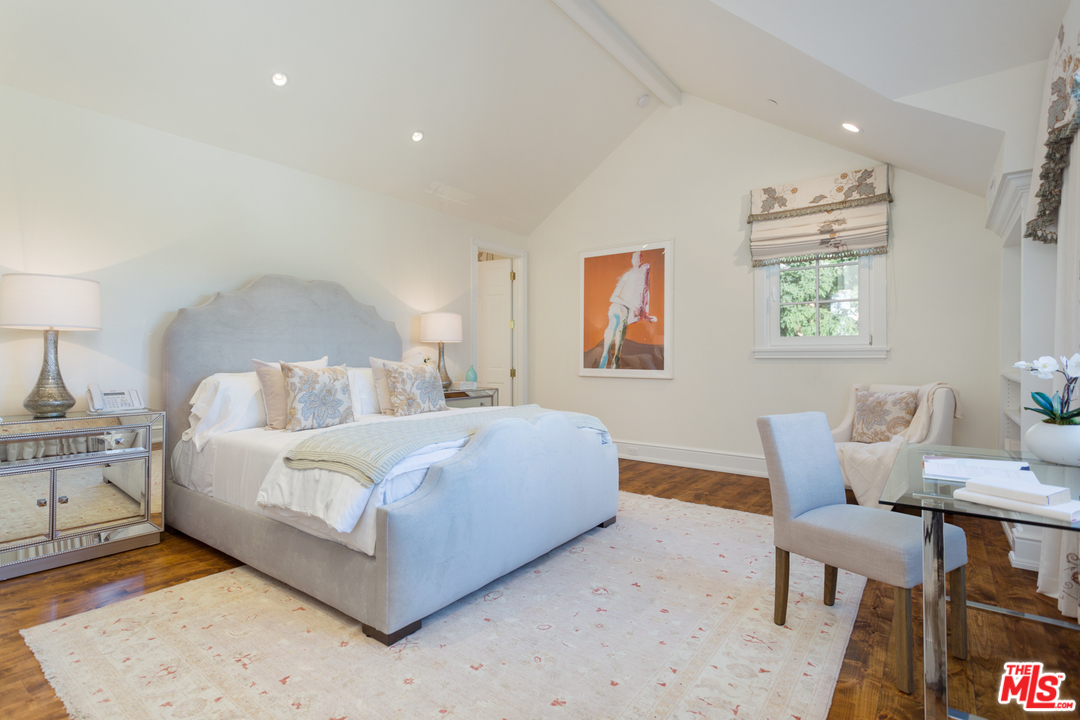 65 Beverly Park Beverly Hills, CA 90210 - Photo 35 of 51 a bed room with a bed and a chair