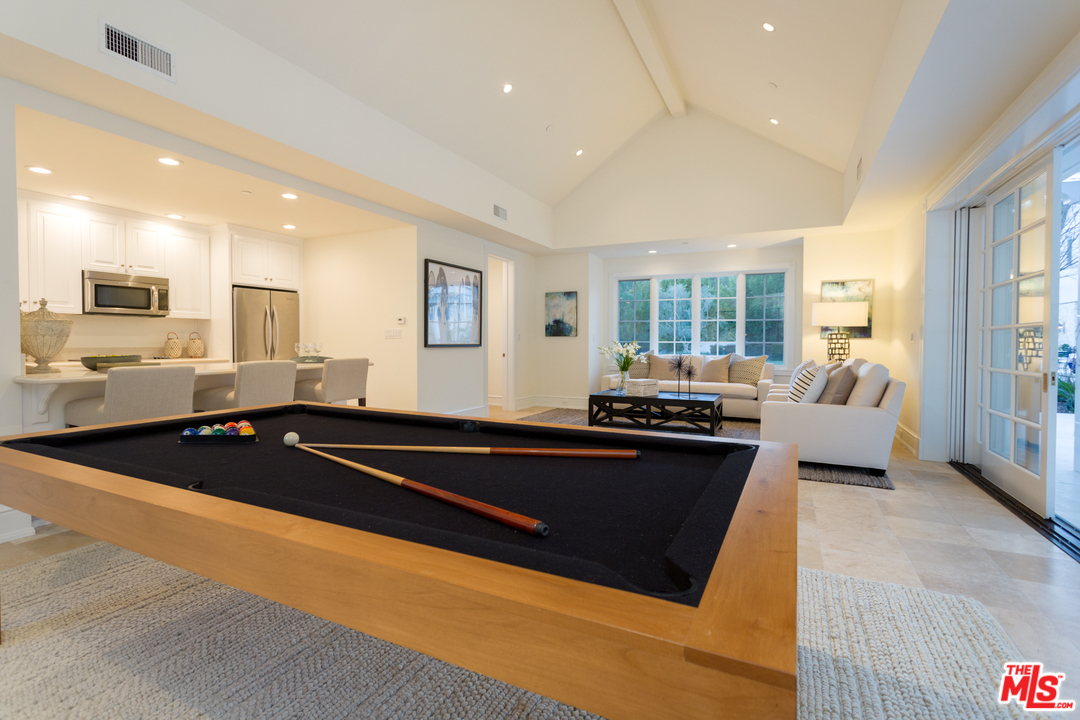 65 Beverly Park Beverly Hills, CA 90210 - Photo 39 of 51 a large kitchen with stainless steel appliances a stove and white cabinets