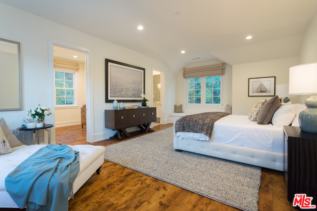 65 Beverly Park Beverly Hills, CA 90210 - Photo 41 of 51 a spacious bedroom with a bed window and couch