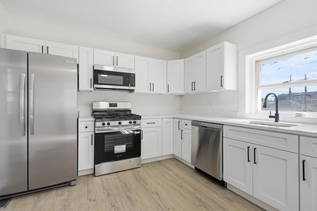 812 Linden Street Bethlehem, PA 18018 - Photo 8 of 39 A well-appointed kitchen features stainless steel appliances and abundant cabinetry.