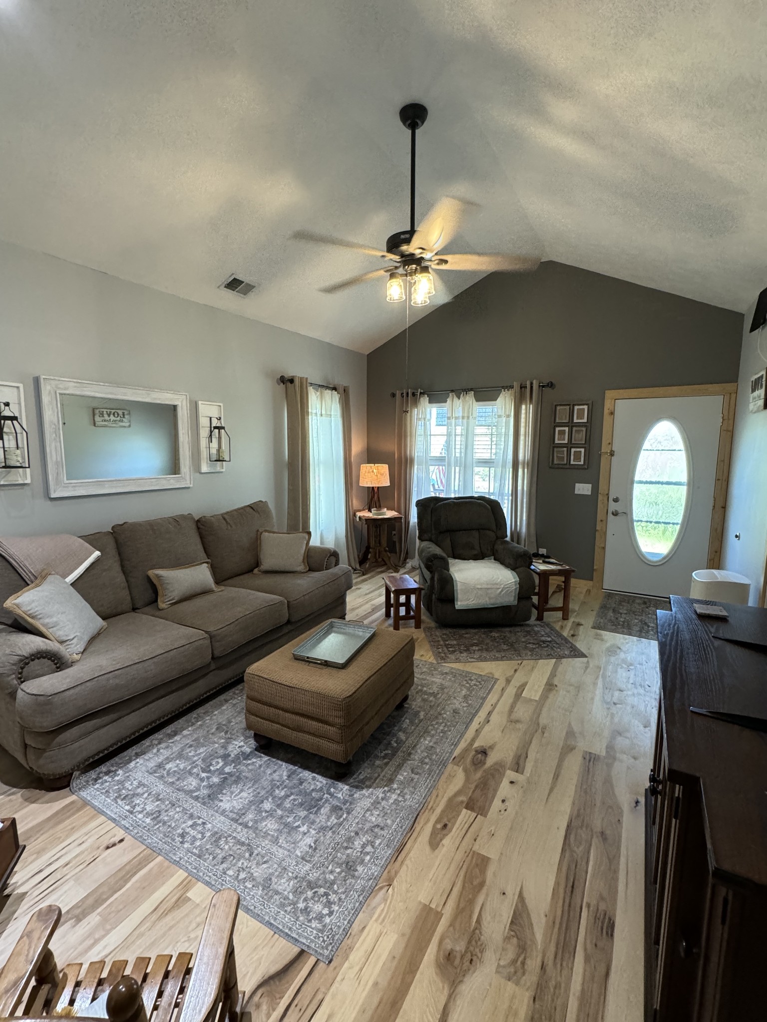 284 Baker Road Dickson, TN 37055 - Photo 17 of 36 a living room with furniture a chandelier and a rug