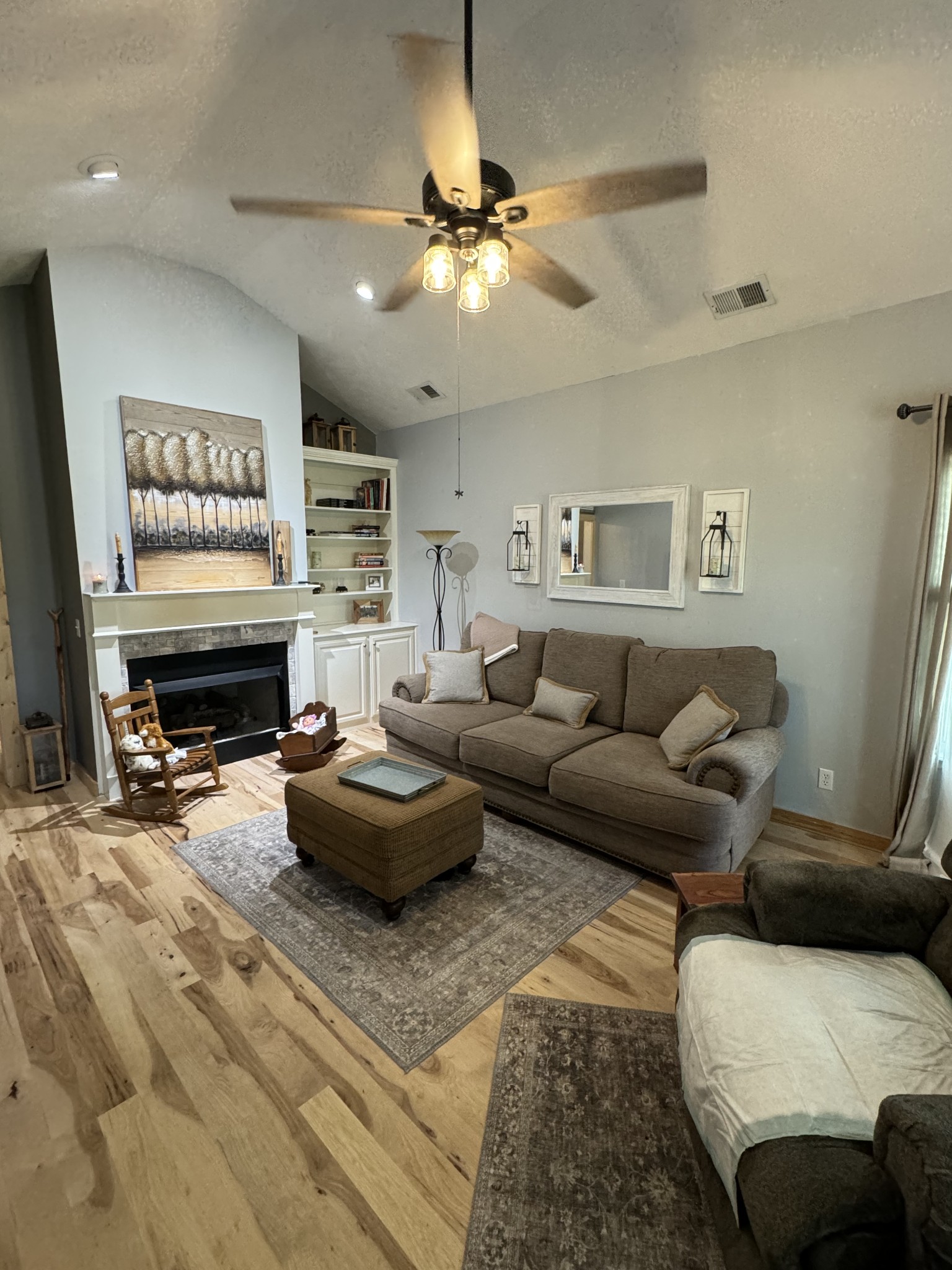 284 Baker Road Dickson, TN 37055 - Photo 18 of 36 a living room with furniture and a fireplace