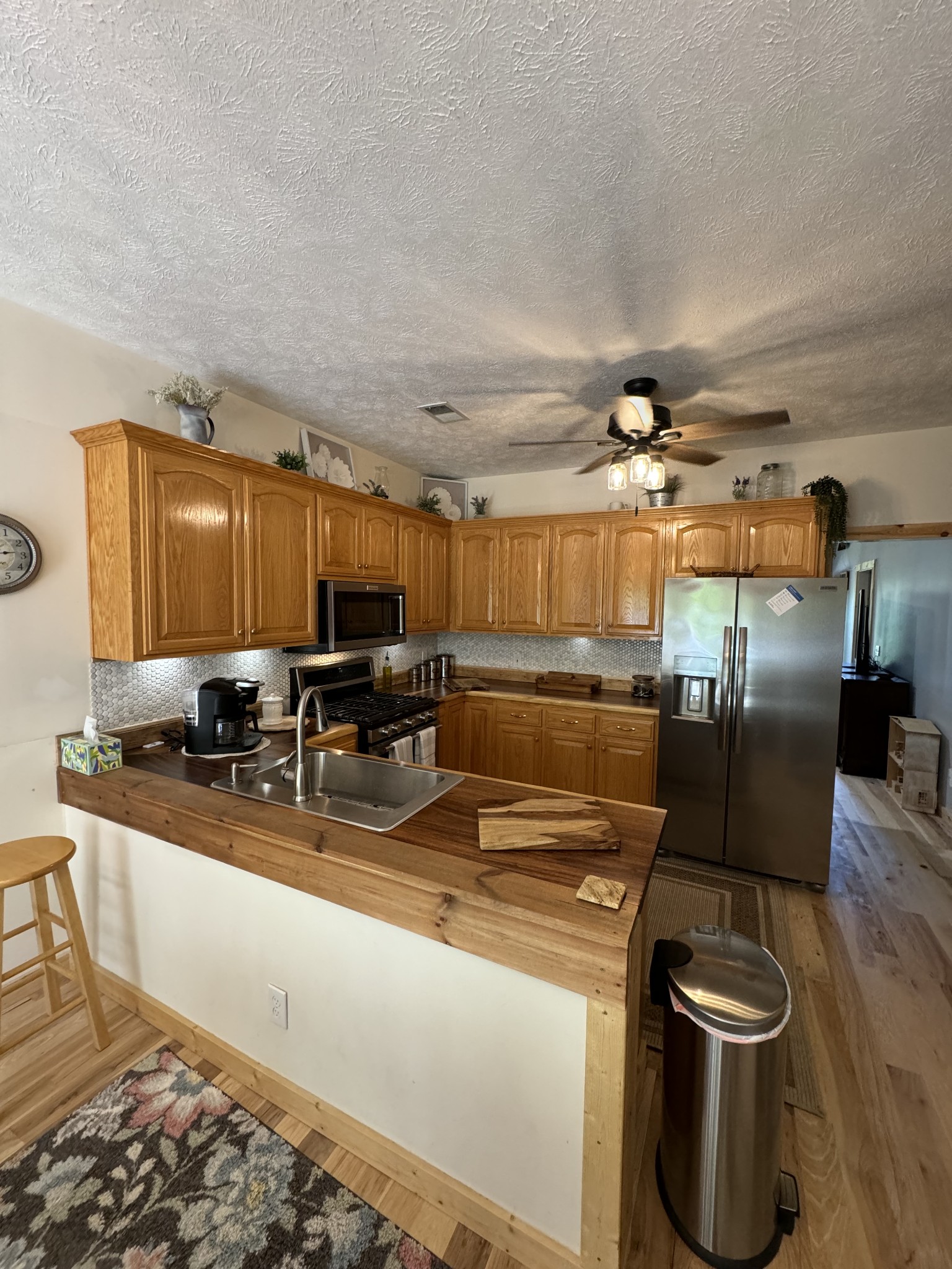 284 Baker Road Dickson, TN 37055 - Photo 23 of 36 a kitchen with stainless steel appliances granite countertop a sink a stove and a refrigerator