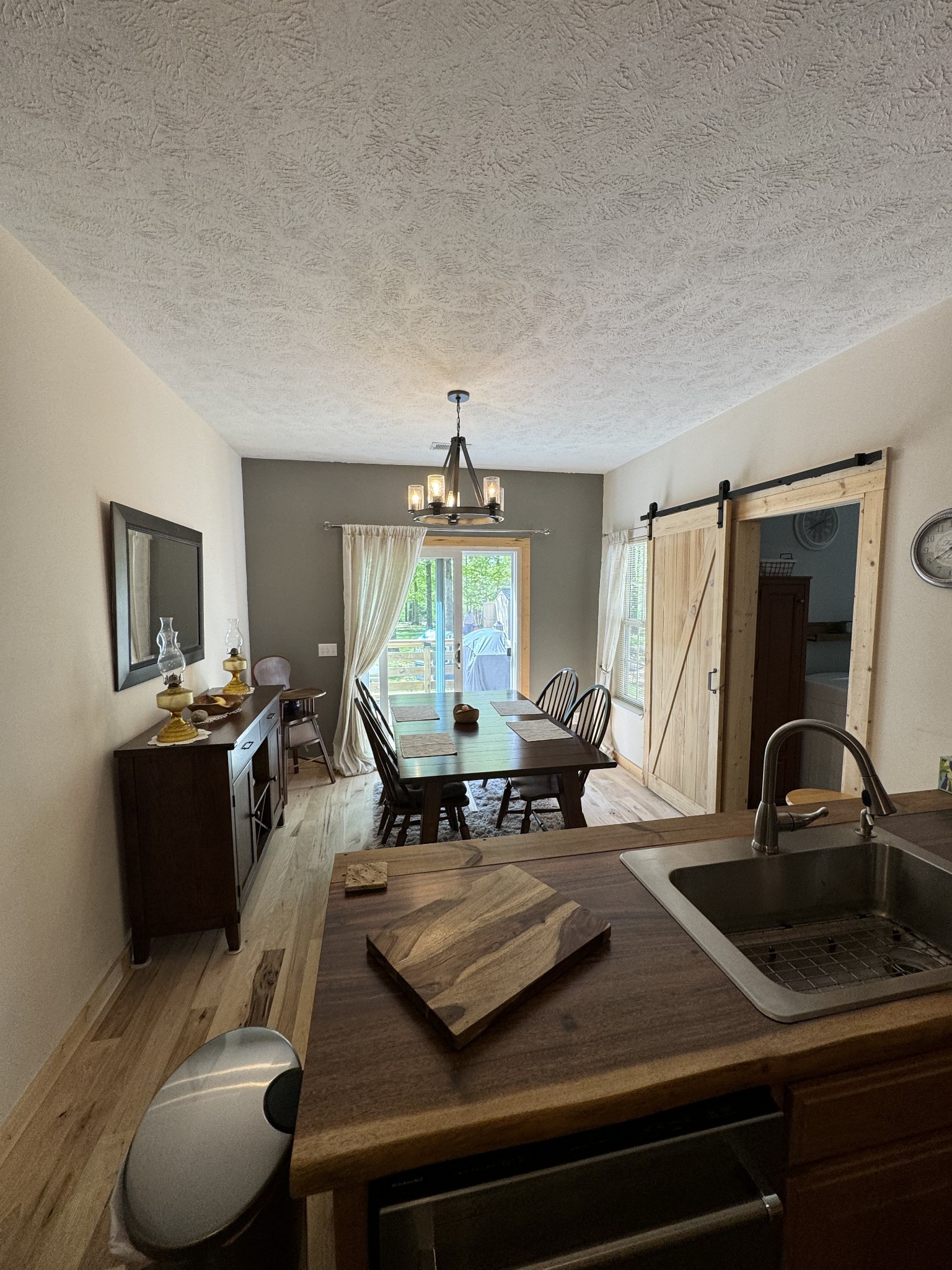 284 Baker Road Dickson, TN 37055 - Photo 27 of 36 a living room with furniture a large window and a flat screen tv