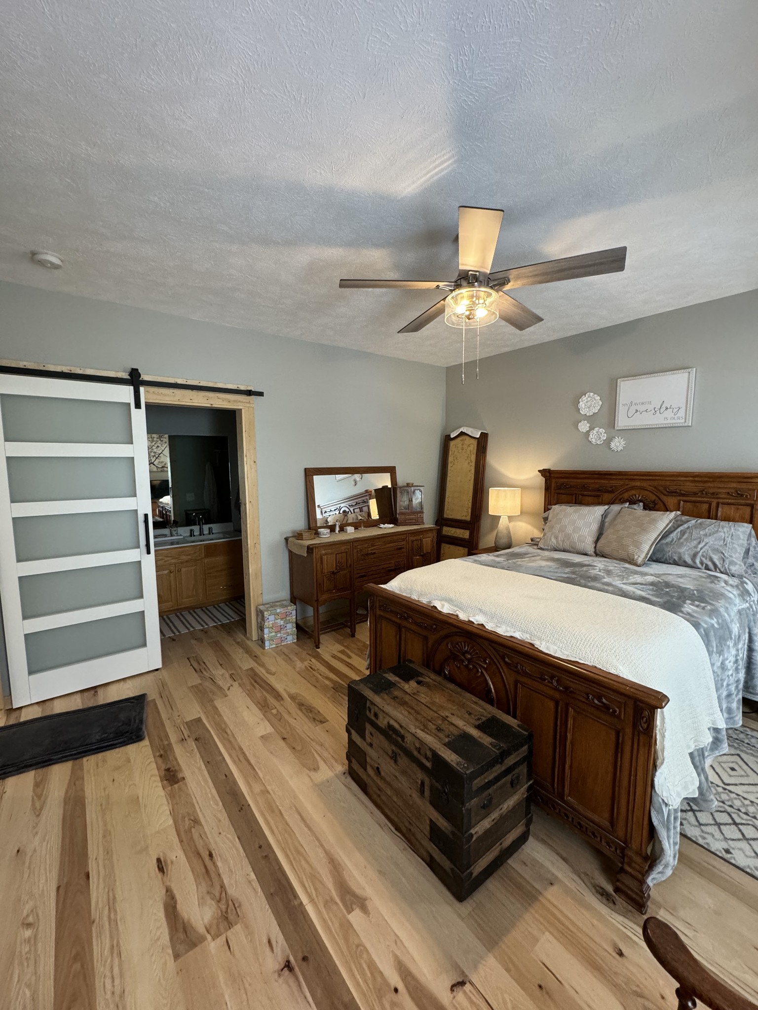 284 Baker Road Dickson, TN 37055 - Photo 29 of 36 a bedroom with a bed and a chandelier