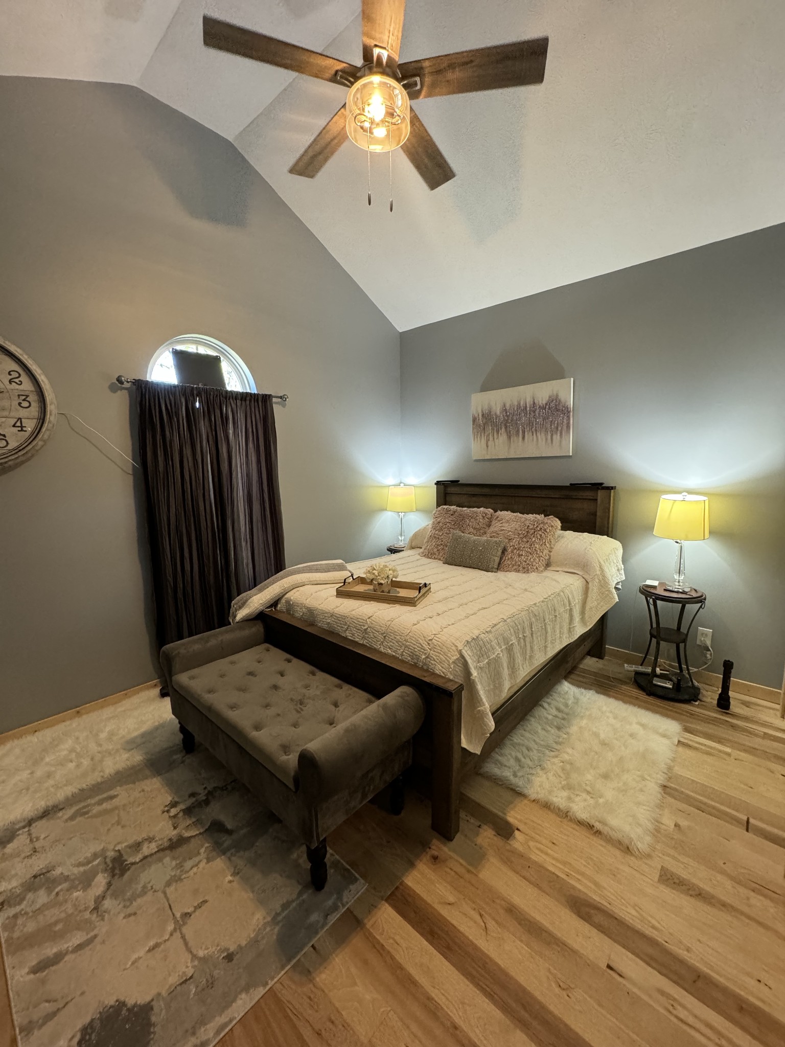 284 Baker Road Dickson, TN 37055 - Photo 31 of 36 a bedroom with a bed and a chandelier