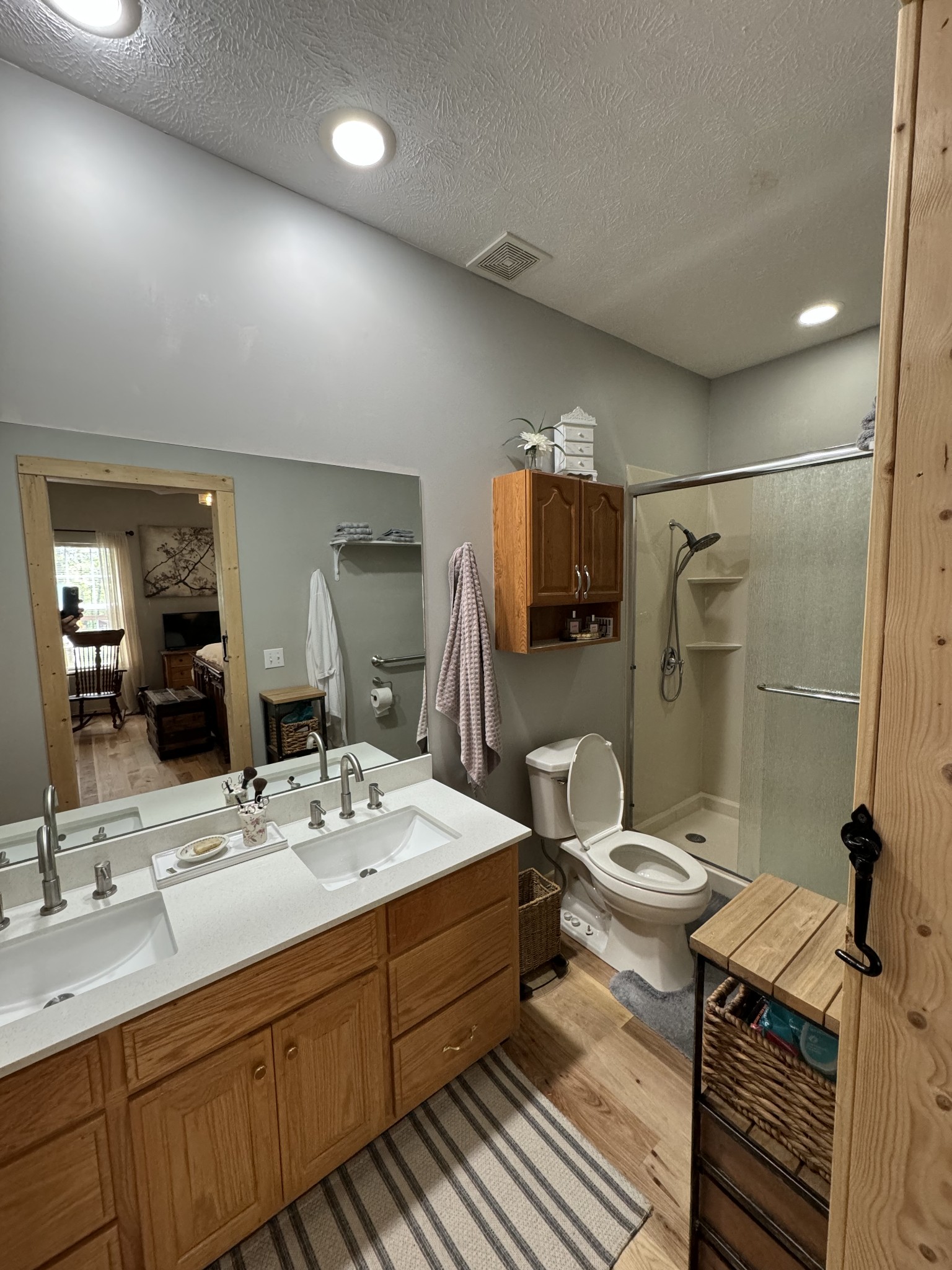284 Baker Road Dickson, TN 37055 - Photo 33 of 36 a bathroom with a double vanity sink toilet and shower