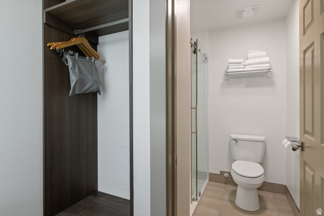 245 Red Cliffs Drive, Unit 104 St. George, UT 84790 - Photo 21 of 33 Full bathroom with toilet and a stall shower